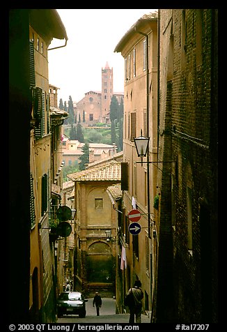 Narrow street with church in background. Siena, Tuscany, Italy (color)