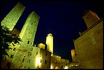 Medieval towers above Piazza del Duomo at night. San Gimignano, Tuscany, Italy