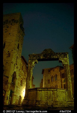 Well on Piazza della Cisterna at night. San Gimignano, Tuscany, Italy (color)
