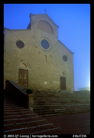 Duomo at dawn in the fog. San Gimignano, Tuscany, Italy