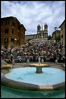 Fontana della Barcaccia and Spanish Steps covered with tourists sitting. Rome, Lazio, Italy