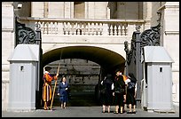 Nuns move past checkpoint manned by Swiss guards. Vatican City