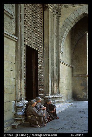 Nuns sit outside of one of  many churches of the historic town. Naples, Campania, Italy (color)