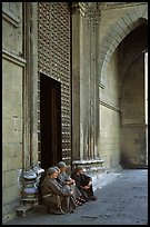 Nuns sit outside of one of  many churches of the historic town. Naples, Campania, Italy