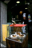 Chef at restaurant doorway with appetizers shown in glass case. Naples, Campania, Italy ( color)