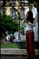 Young woman talking on a cell phone. Naples, Campania, Italy