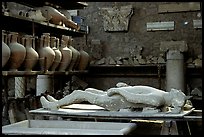 Artifacts found during the excavations, including a petrified man. Pompeii, Campania, Italy (color)