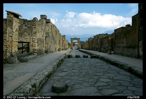 Street with roman period pavement and sidewalks. Pompeii, Campania, Italy