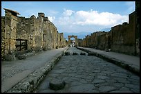 Street with roman period pavement and sidewalks. Pompeii, Campania, Italy