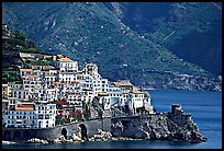 Houses built on a rocky promontory in Amalfi. Amalfi Coast, Campania, Italy