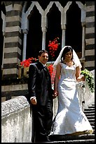 Newly wed couple on the stairs of Duomo Sant'Andrea, Amalfi. Amalfi Coast, Campania, Italy