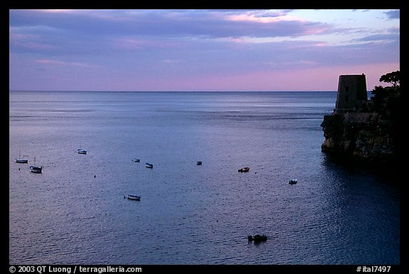 Small boats and tower and sunset, Positano. Amalfi Coast, Campania, Italy