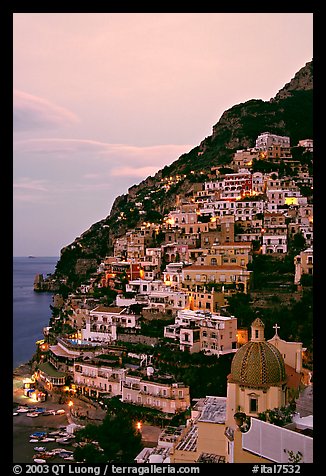 Positano at dawn, with the ceramic dome of Chiesa di Santa Maria Assunta in the foreground. Amalfi Coast, Campania, Italy