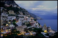 Positano lights coming up at dusk. Amalfi Coast, Campania, Italy