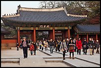 People walking down gate, Changdeok Palace. Seoul, South Korea