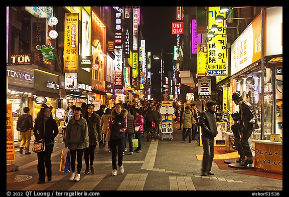 Shoppers on pedestrian street by night. Seoul, South Korea (color)