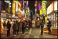 Shoppers on pedestrian street by night. Seoul, South Korea ( color)