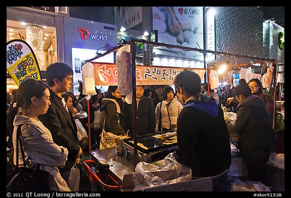 Busy food stall by night. Seoul, South Korea (color)