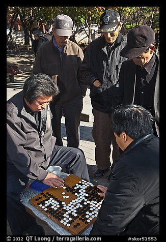 Elderly men play game of baduk (go). Seoul, South Korea (color)