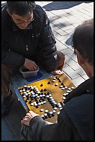 Pondering moves in go (baduk) game. Seoul, South Korea (color)