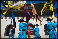 Guards carrying flags in front of main gate, Gyeongbokgung. Seoul, South Korea