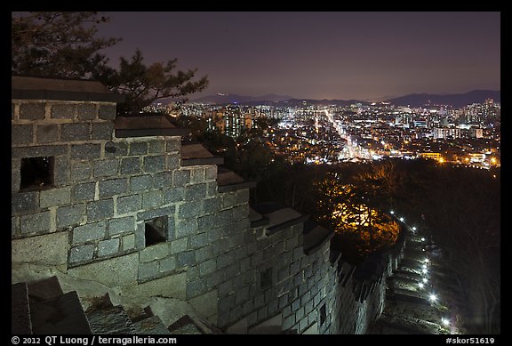 Rampart wall and city lights, Suwon Hwaseong Fortress. South Korea (color)