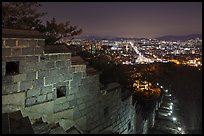 Rampart wall and city lights, Suwon Hwaseong Fortress. South Korea