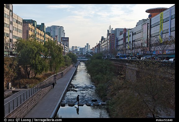 Pedestrians walking through Cheonggyecheon river park. Seoul, South Korea