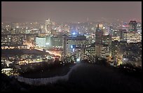 Old fortress wall and city skyline at night. Seoul, South Korea (color)