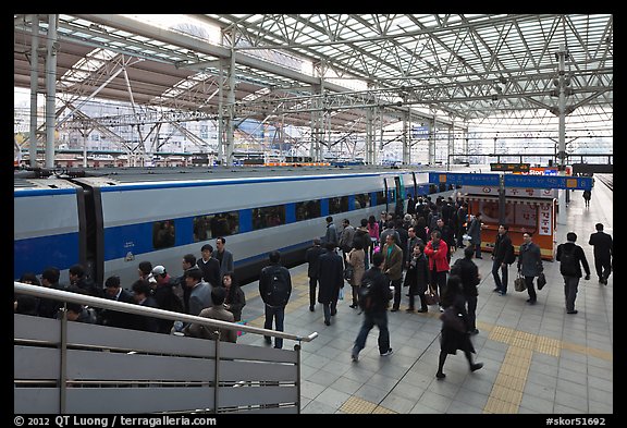 Passengers boarding high speed KTX train. Seoul, South Korea (color)