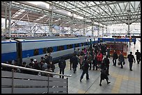 Passengers boarding high speed KTX train. Seoul, South Korea (color)