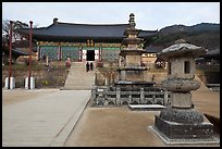 Three-story stone pagoda and main hall, Haeinsa Temple. South Korea (color)