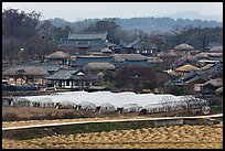 Fields, greenhouses, and village. Hahoe Folk Village, South Korea