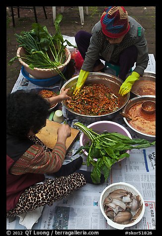 Women mixing traditional fermented kimchee. Gyeongju, South Korea