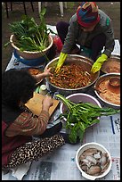 Women mixing traditional fermented kimchee. Gyeongju, South Korea (color)