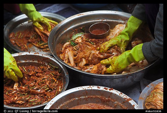 Hands seen mixing kim chee. Gyeongju, South Korea