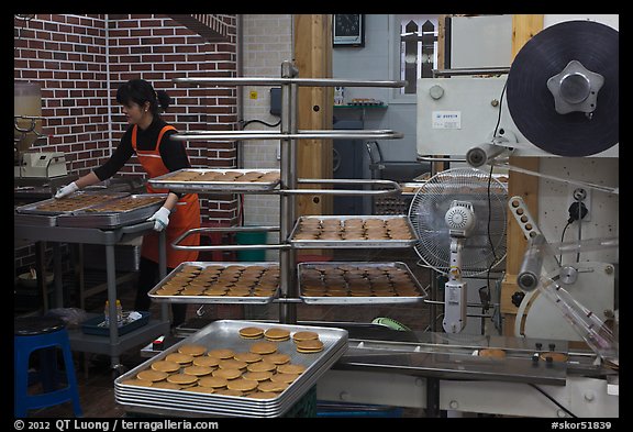 Woman baking Gyeongju barley bread. Gyeongju, South Korea