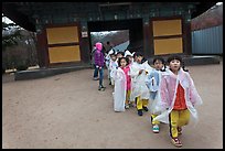 Schoolchildren with raingear, Bulguksa. Gyeongju, South Korea