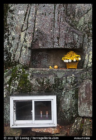 Shrine with candles and flowers, Mt Namsan. Gyeongju, South Korea (color)