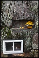 Shrine with candles and flowers, Mt Namsan. Gyeongju, South Korea (color)