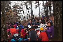 Large group of hikers eating on Geumobong Peak, Namsan Mountain. Gyeongju, South Korea ( color)