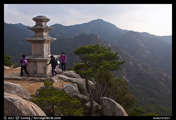 Women circling stone pagoda, Mt Namsan. Gyeongju, South Korea (color)