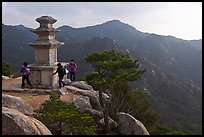 Women circling stone pagoda, Mt Namsan. Gyeongju, South Korea