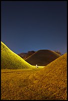 Grassy burial tumulus at night. Gyeongju, South Korea