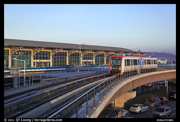 Subway on elevated bridge near airport, Busan. South Korea (color)