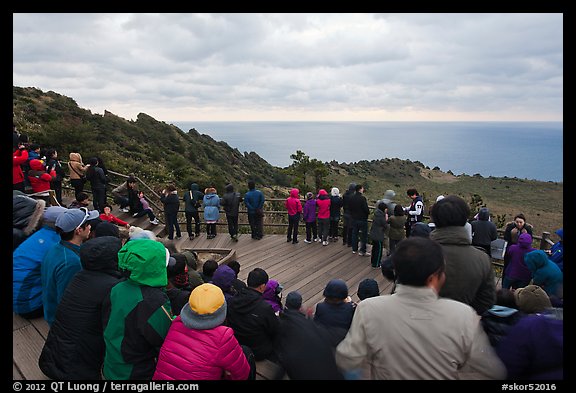 Viewers waiting for sunrise on Ilchulbong. Jeju Island, South Korea (color)