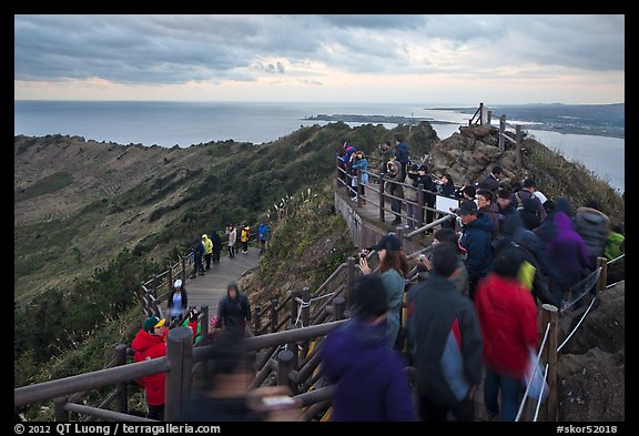 Tourists on top of Seongsang Ilchulbong. Jeju Island, South Korea (color)