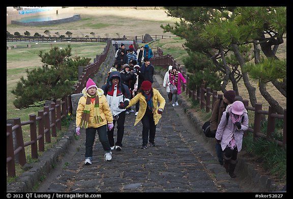 Tourists walking up path, Ilchulbong. Jeju Island, South Korea (color)