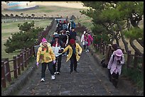 Tourists walking up path, Ilchulbong. Jeju Island, South Korea ( color)