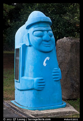 Telephone cabin shaped like Dolharubang. Jeju Island, South Korea (color)